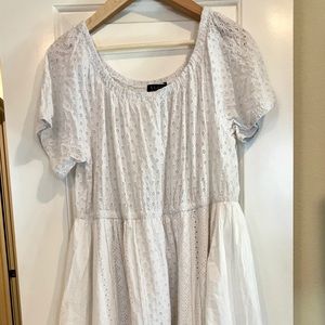 White cotton dress with eyelet design.